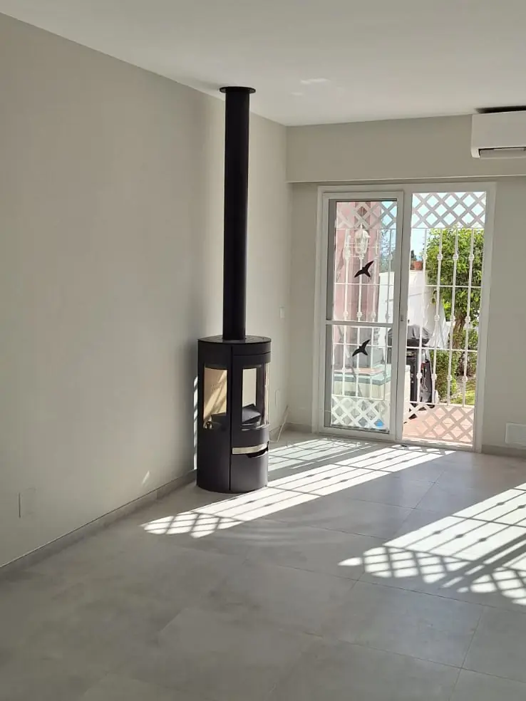 Living room reform with log burner installed — after