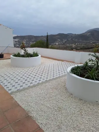 Roof terrace reform with planters and decorative tiling — after